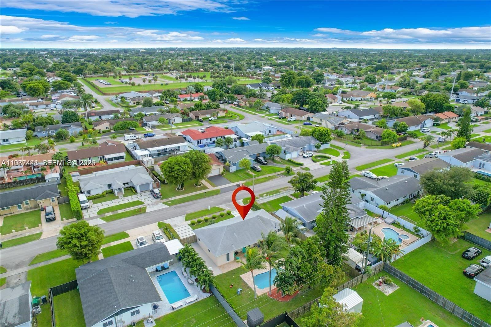 10471 Southwest 164th Street Miami, FL 33157 - Photo 3 of 15 an aerial view of residential houses with outdoor space and street view