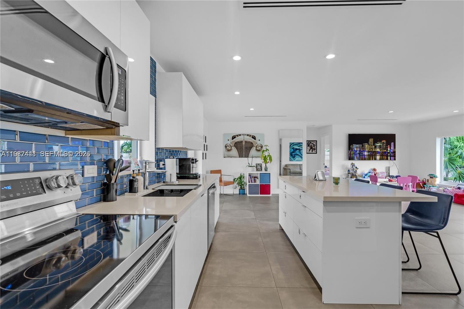 10471 Southwest 164th Street Miami, FL 33157 - Photo 8 of 15 a living room with furniture and a flat screen tv