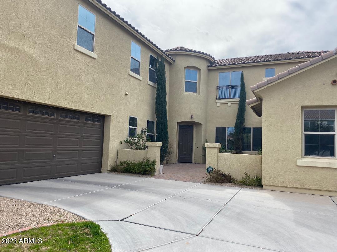 2757 East Powell Way Gilbert, AZ 85298 - Photo 1 of 29 a front view of a house with a garage