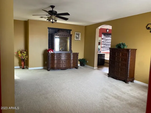 a view of a livingroom with furniture and a chandelier