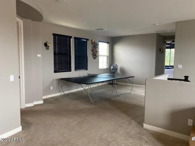 a living room with furniture and window