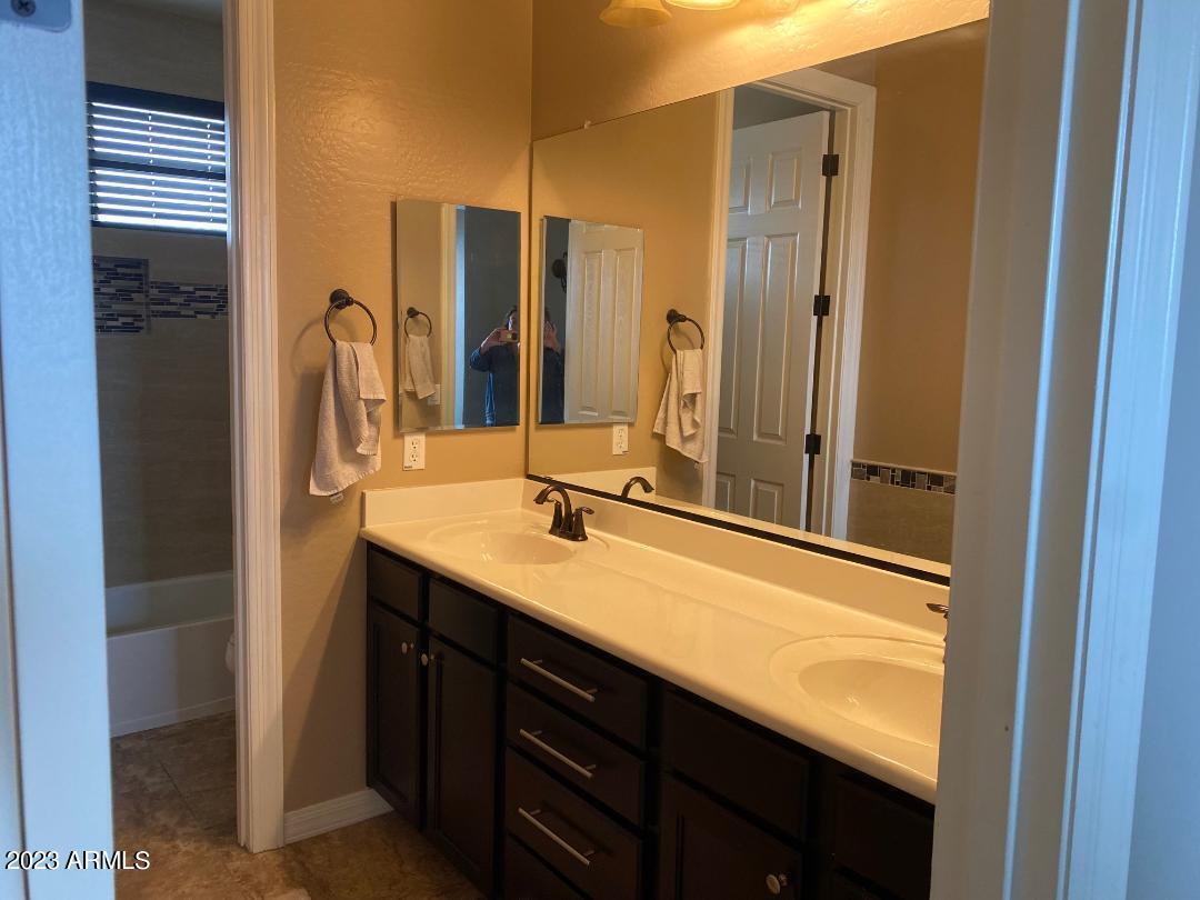 2757 East Powell Way Gilbert, AZ 85298 - Photo 22 of 29 a bathroom with a double vanity sink and mirror