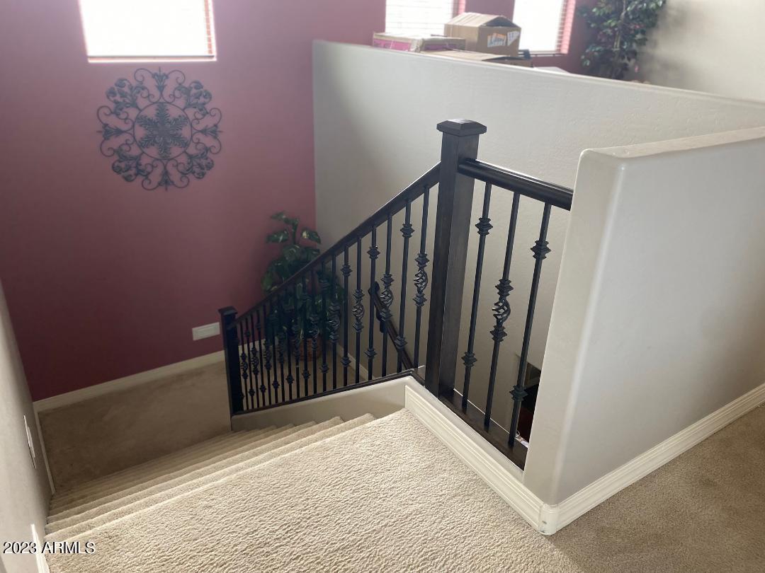 2757 East Powell Way Gilbert, AZ 85298 - Photo 23 of 29 a view of a hallway with wooden floor and staircase