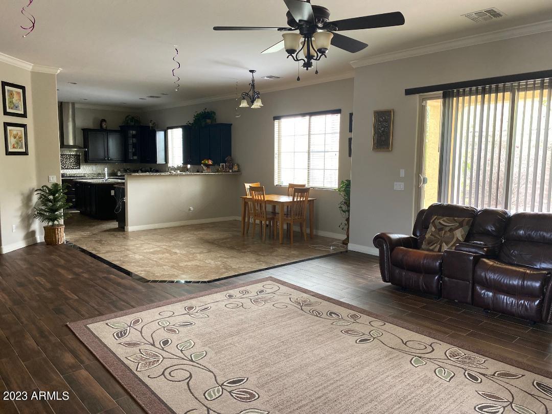2757 East Powell Way Gilbert, AZ 85298 - Photo 5 of 29 a living room with furniture and a large window