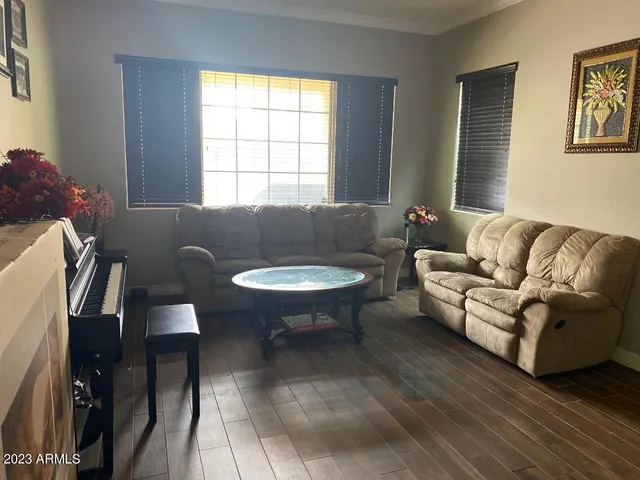 a living room with furniture and a window