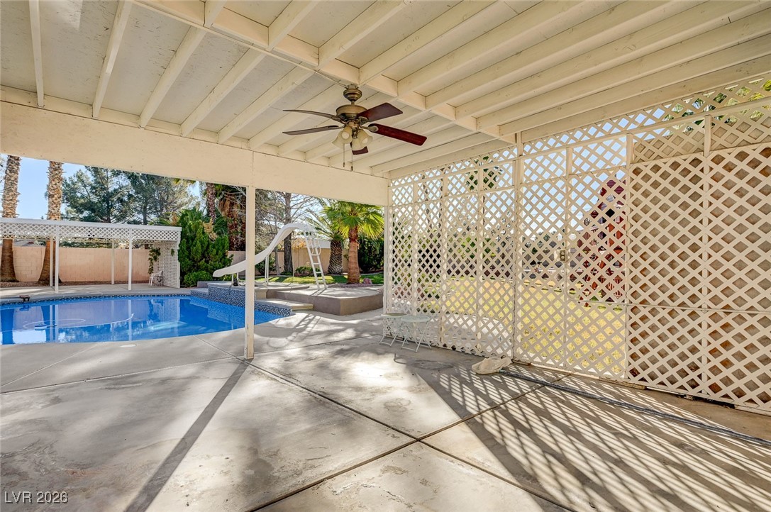 2955 El Camino Road Las Vegas, NV 89146 - Photo 91 of 99 View of swimming pool featuring a water slide, a patio area, and a fenced backyard