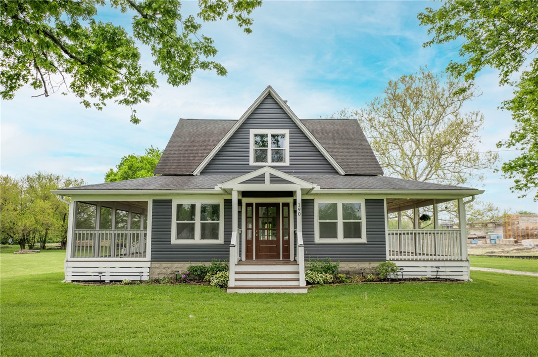 190 Swailes Road Troy, OH 45373 - Photo 1 of 82 This charming home offers a welcoming facade with a screened porch and ample green space.