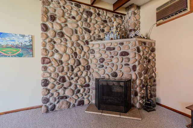 a room with a fireplace and a walk in closet