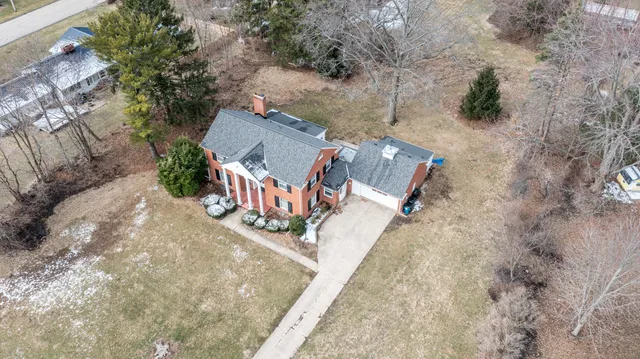 an aerial view of a house with outdoor space