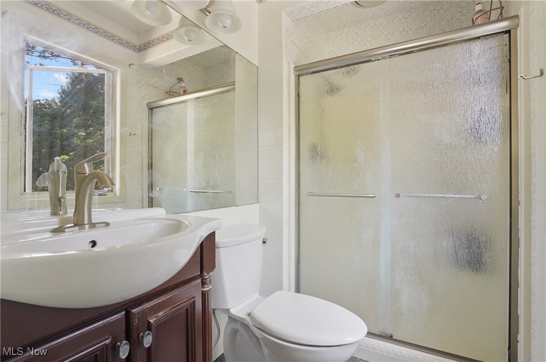 649 South Medina Line Road Akron, OH 44321 - Photo 19 of 50 Full bath with vanity and a stall shower