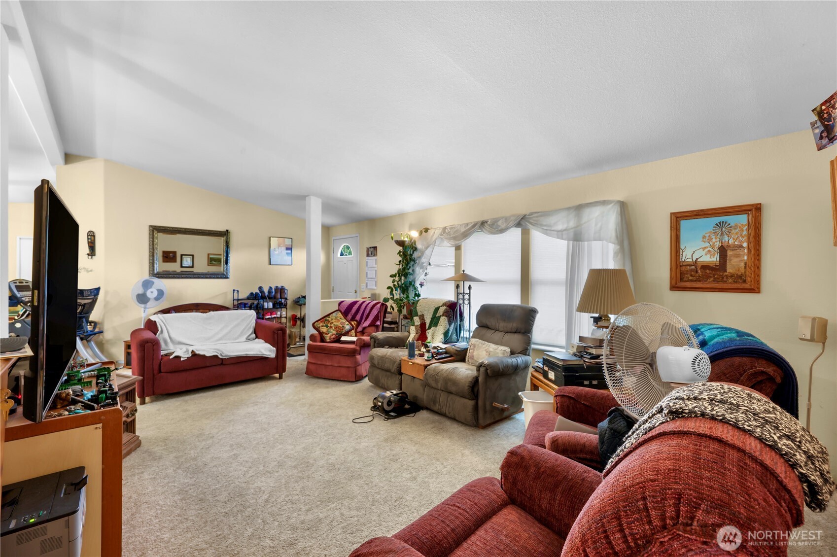 7928 Portal Way Custer, WA 98240 - Photo 7 of 39 a living room with furniture or couch and a flat screen tv