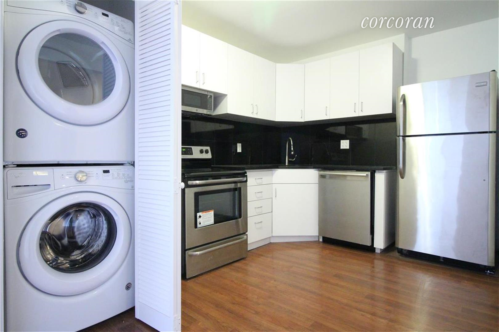 a kitchen with a washer and dryer