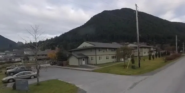 a living room with fireplace and furniture