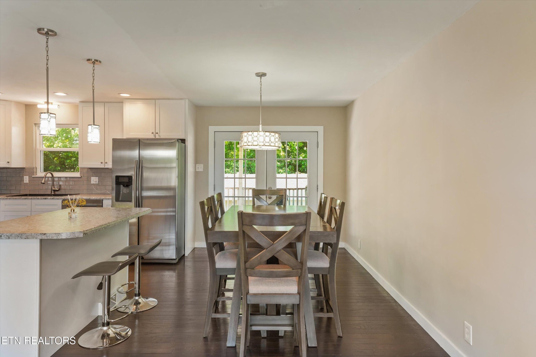 7613 Fall Wind Court Powell, TN 37849 - Photo 14 of 38 a dining room with furniture a chandelier and wooden floor