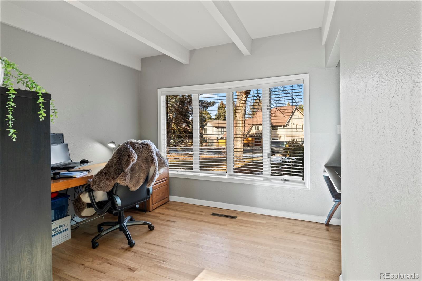 15780 Sandtrap Way Morrison, CO 80465 - Photo 12 of 36 a view of a workspace with furniture and a window