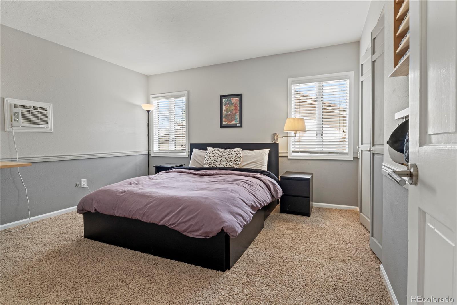 15780 Sandtrap Way Morrison, CO 80465 - Photo 20 of 36 a bedroom with a bed next to a window with a dresser