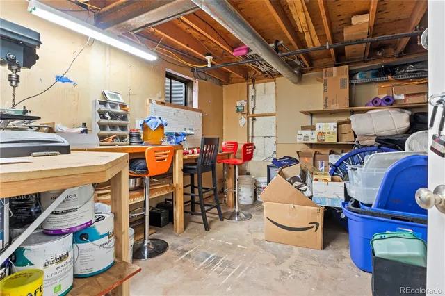 a view of a patio with table and chairs
