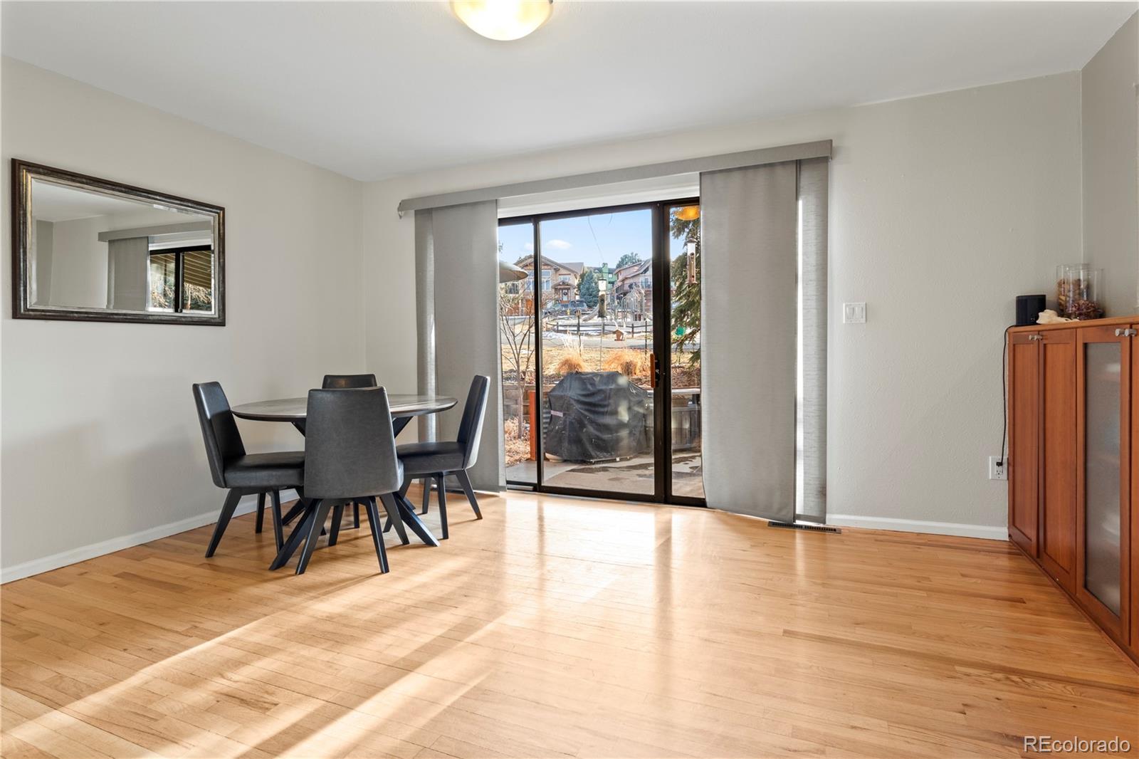 15780 Sandtrap Way Morrison, CO 80465 - Photo 6 of 36 a view of a livingroom with furniture and a dining table