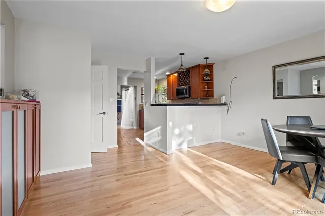 a workspace with wooden floor and furniture