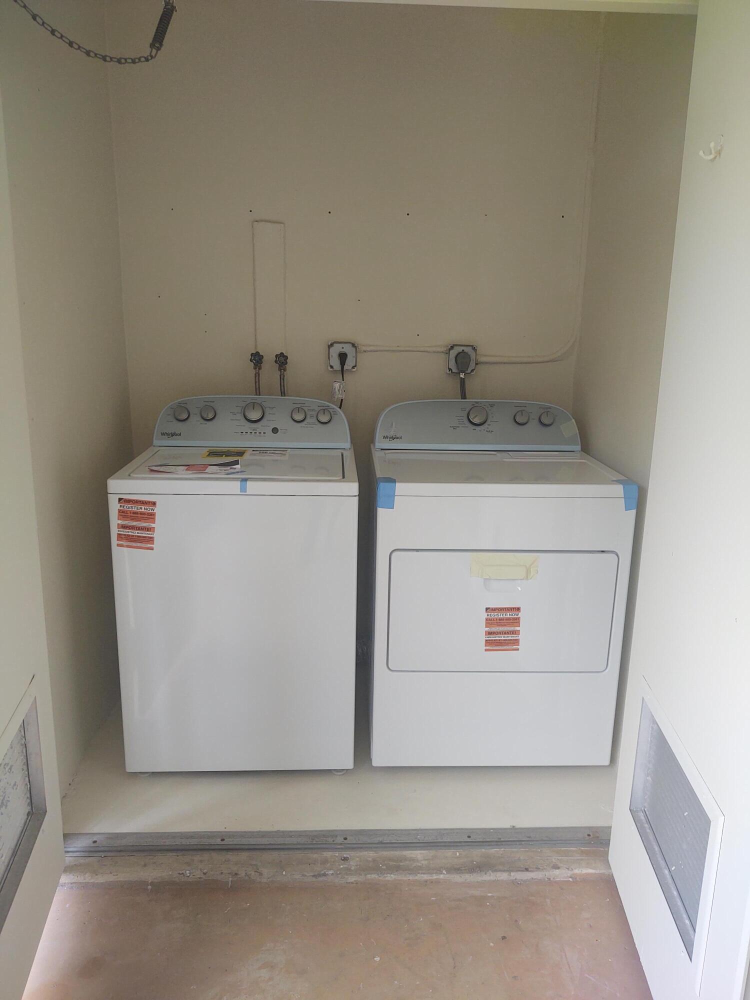 140 Northwest 70th Street, Unit 2040 Boca Raton, FL 33487 - Photo 14 of 18 a utility room with dryer and washer