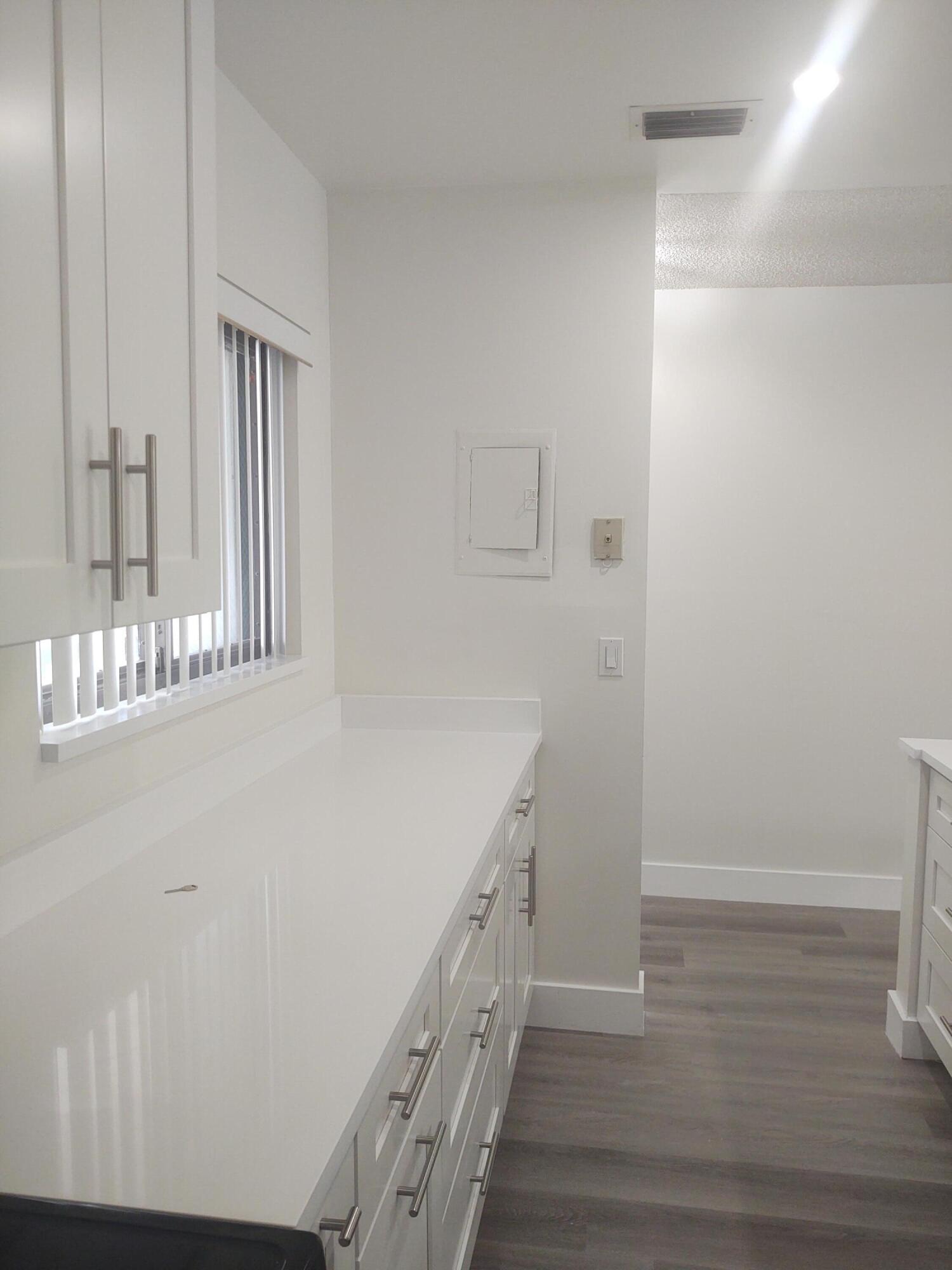 140 Northwest 70th Street, Unit 2040 Boca Raton, FL 33487 - Photo 6 of 18 a bathroom with a sink and a mirror