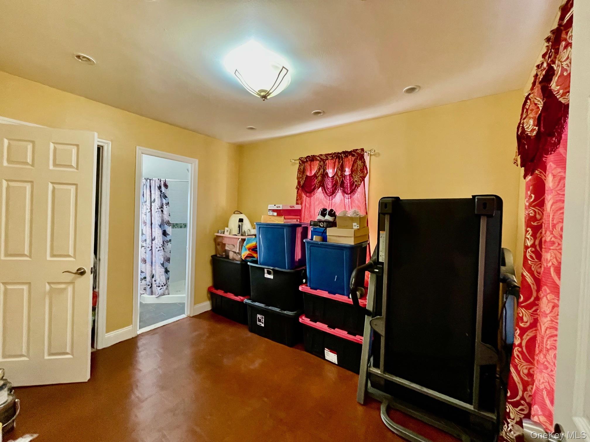 102-03 Rau Court Queens, NY 11414 - Photo 3 of 12 wooden floor with furniture and a flat screen tv
