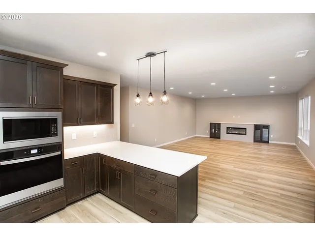 a view of living room with furniture and stairs