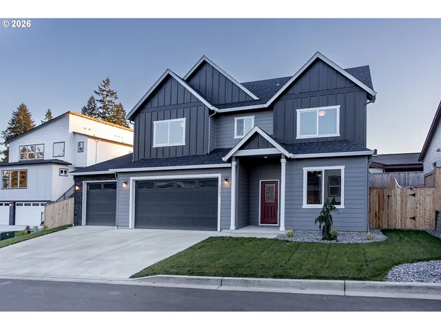 a front view of a house with yard