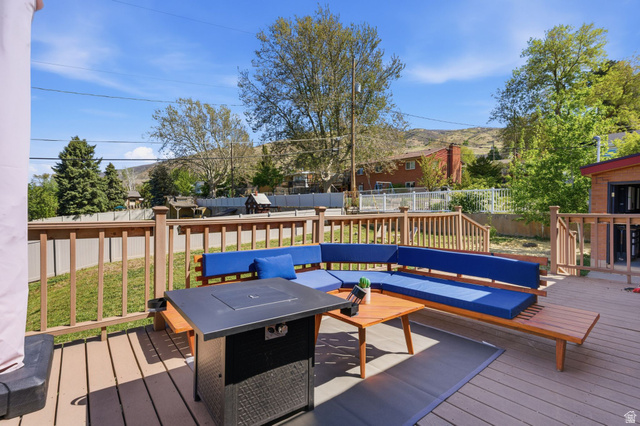 935 900 North Bountiful, UT 84010 - Photo 33 of 46 Deck with a fenced backyard, an outdoor hangout area, and a mountain view