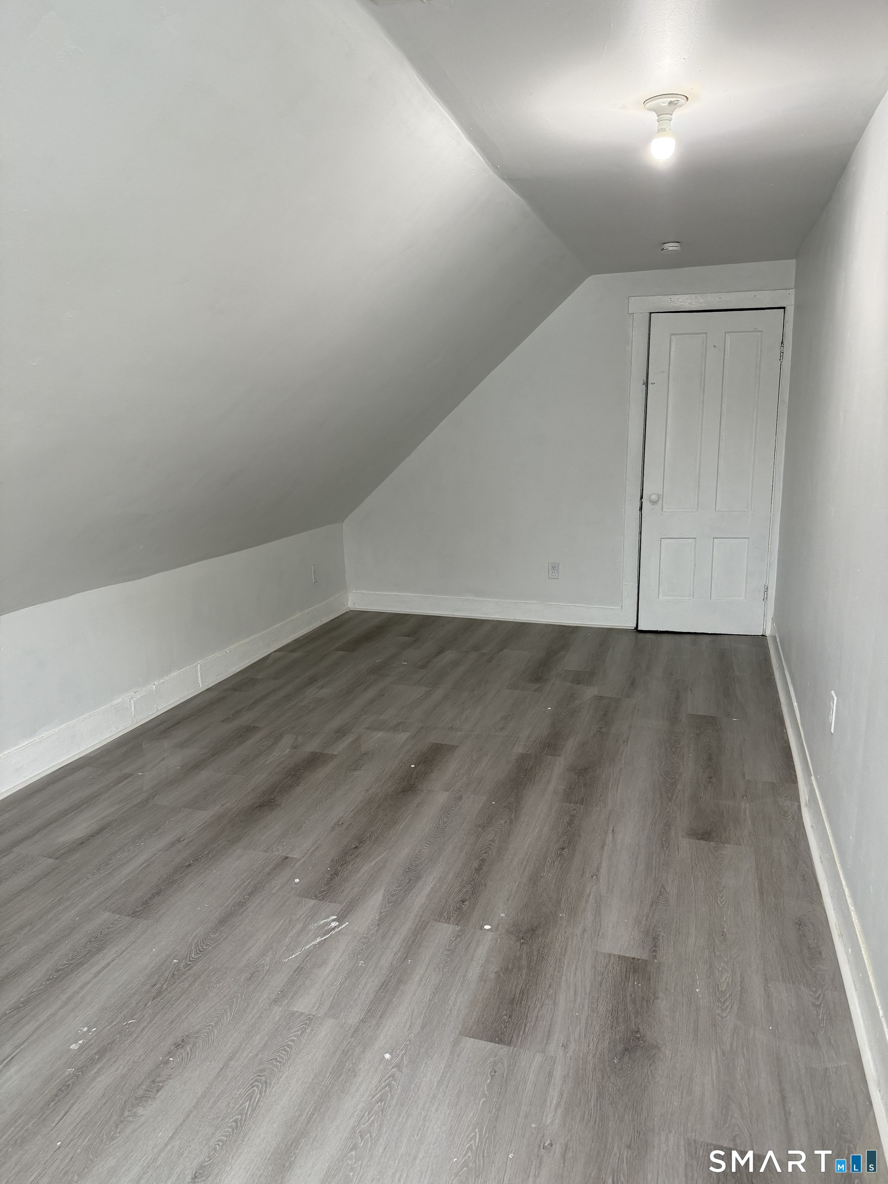 21 Edgar Street, Unit 2 New Haven, CT 06519 - Photo 12 of 20 a view of an empty room with wooden floor