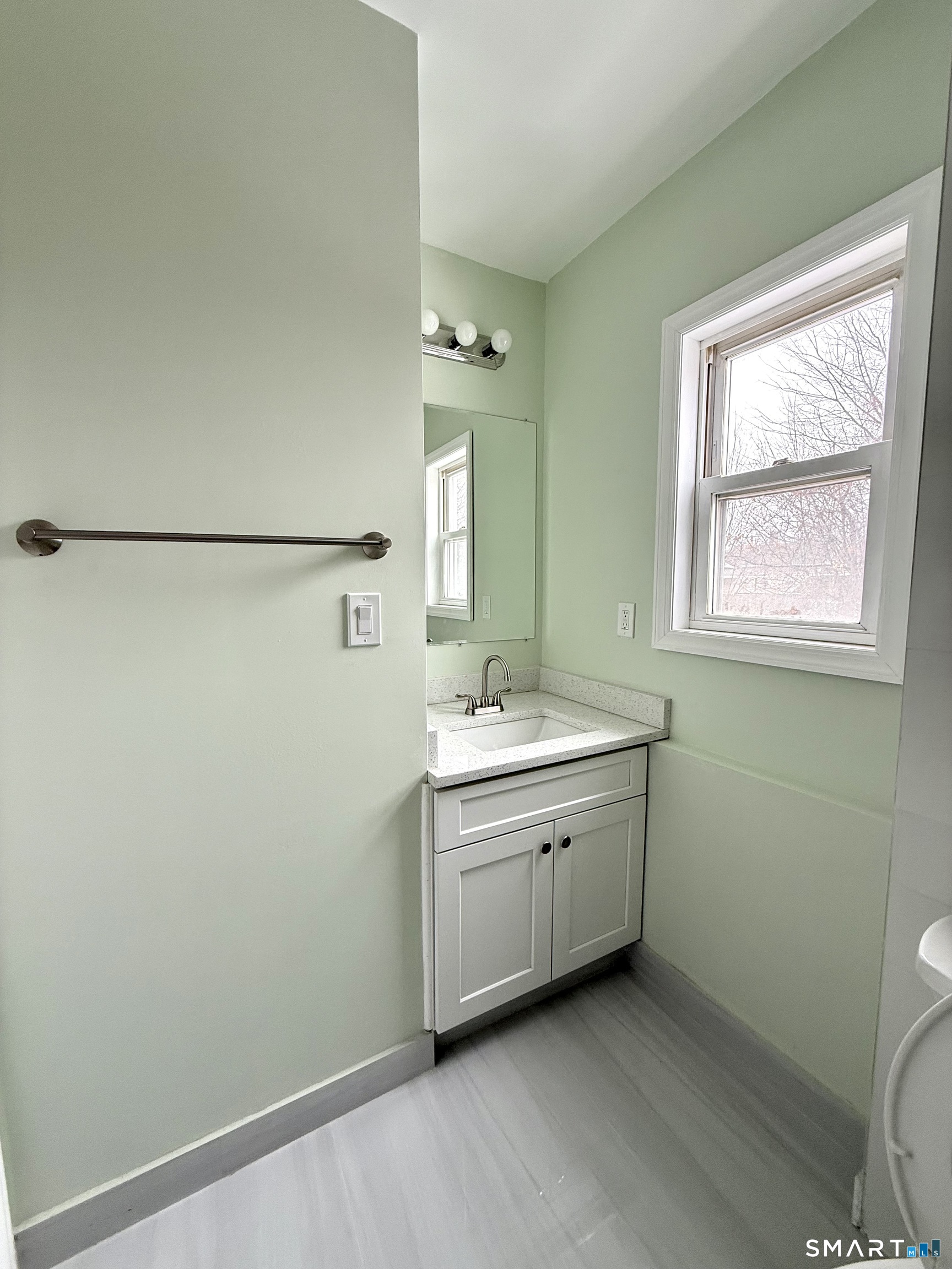 21 Edgar Street, Unit 2 New Haven, CT 06519 - Photo 5 of 20 a bathroom with a granite countertop sink mirror vanity and toilet