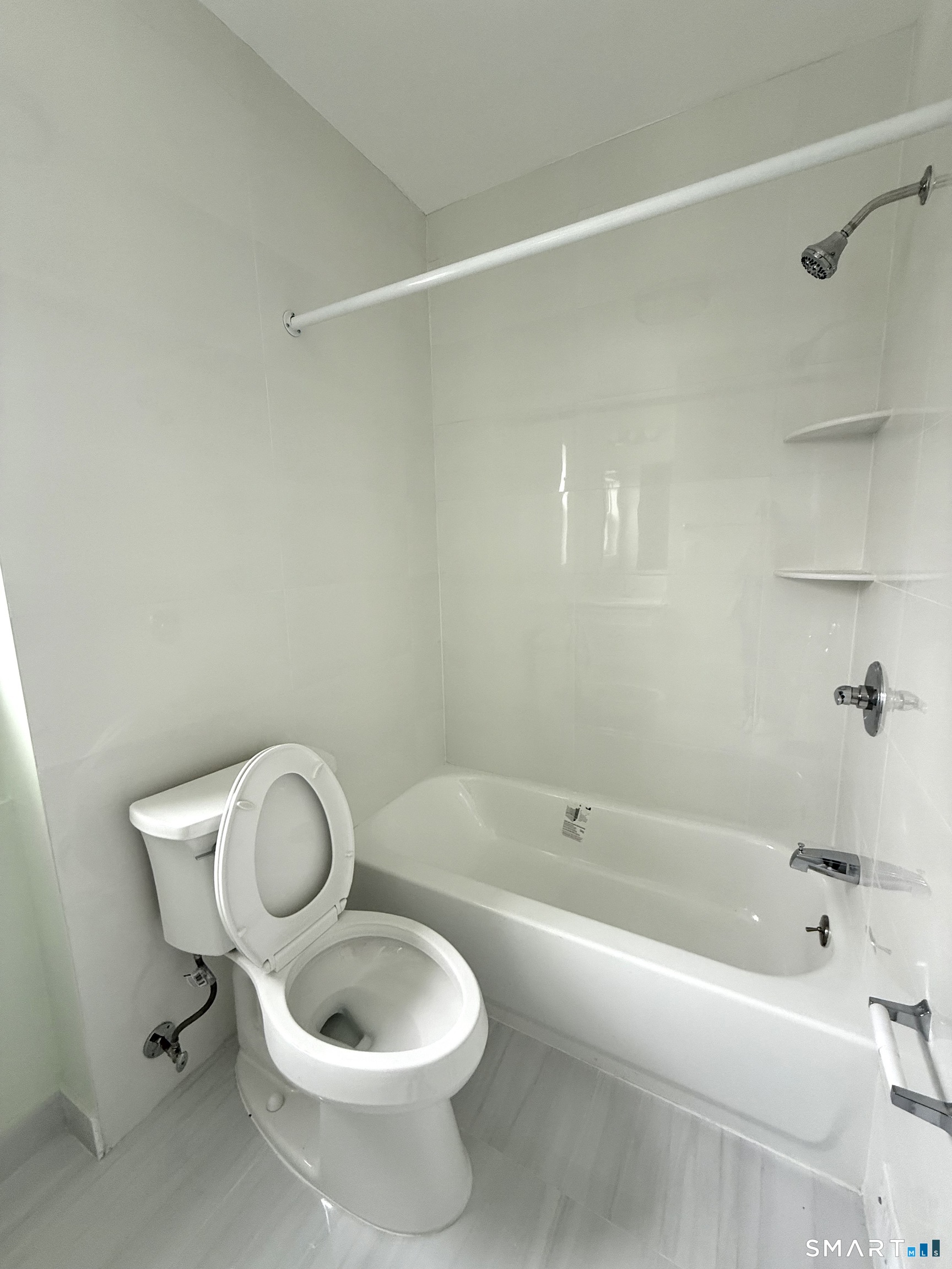 21 Edgar Street, Unit 2 New Haven, CT 06519 - Photo 6 of 20 a white bath tub sitting next to a white toilet and sink