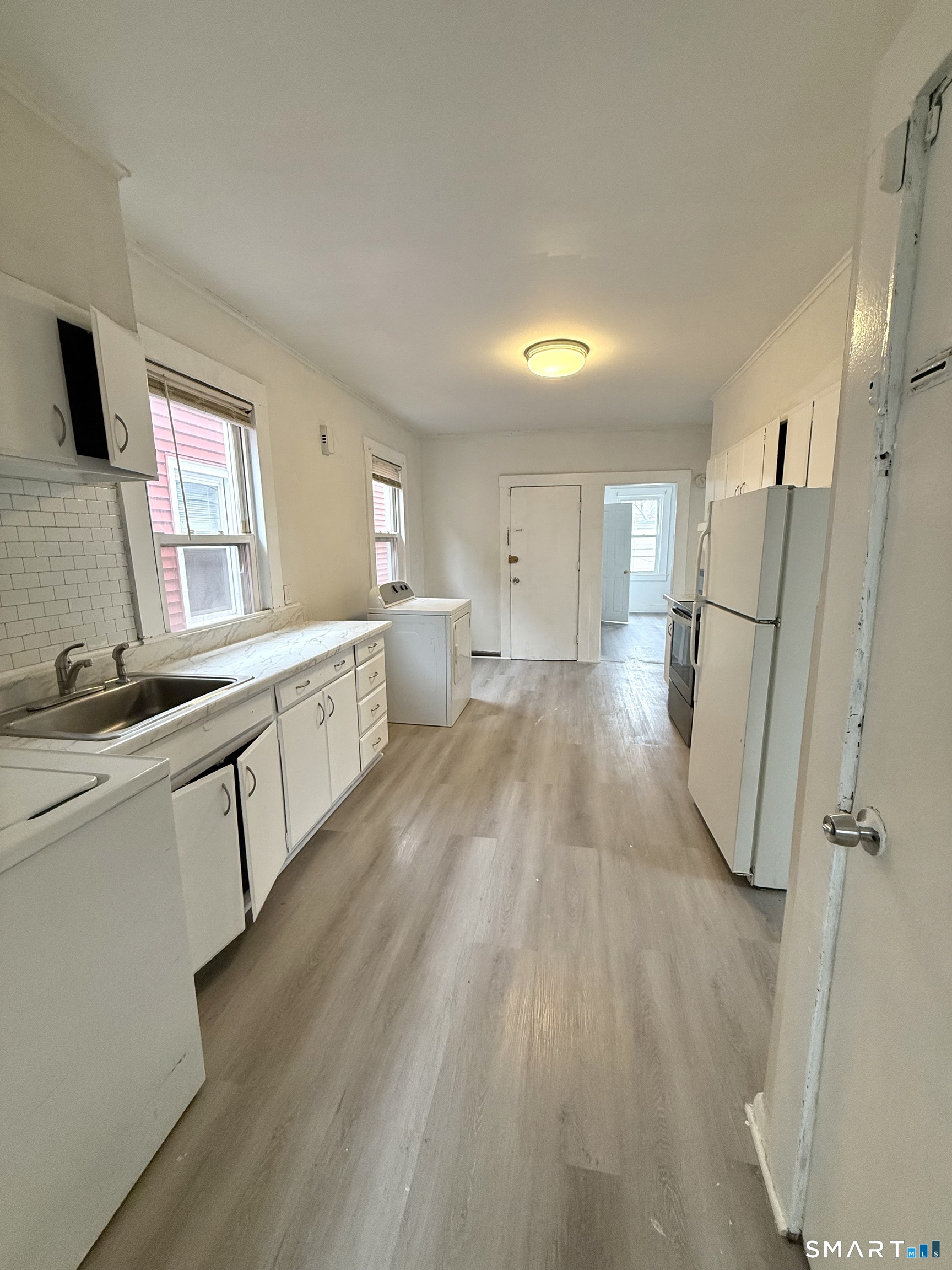 21 Edgar Street, Unit 2 New Haven, CT 06519 - Photo 7 of 20 a large kitchen with a lot of counter space and wooden floor