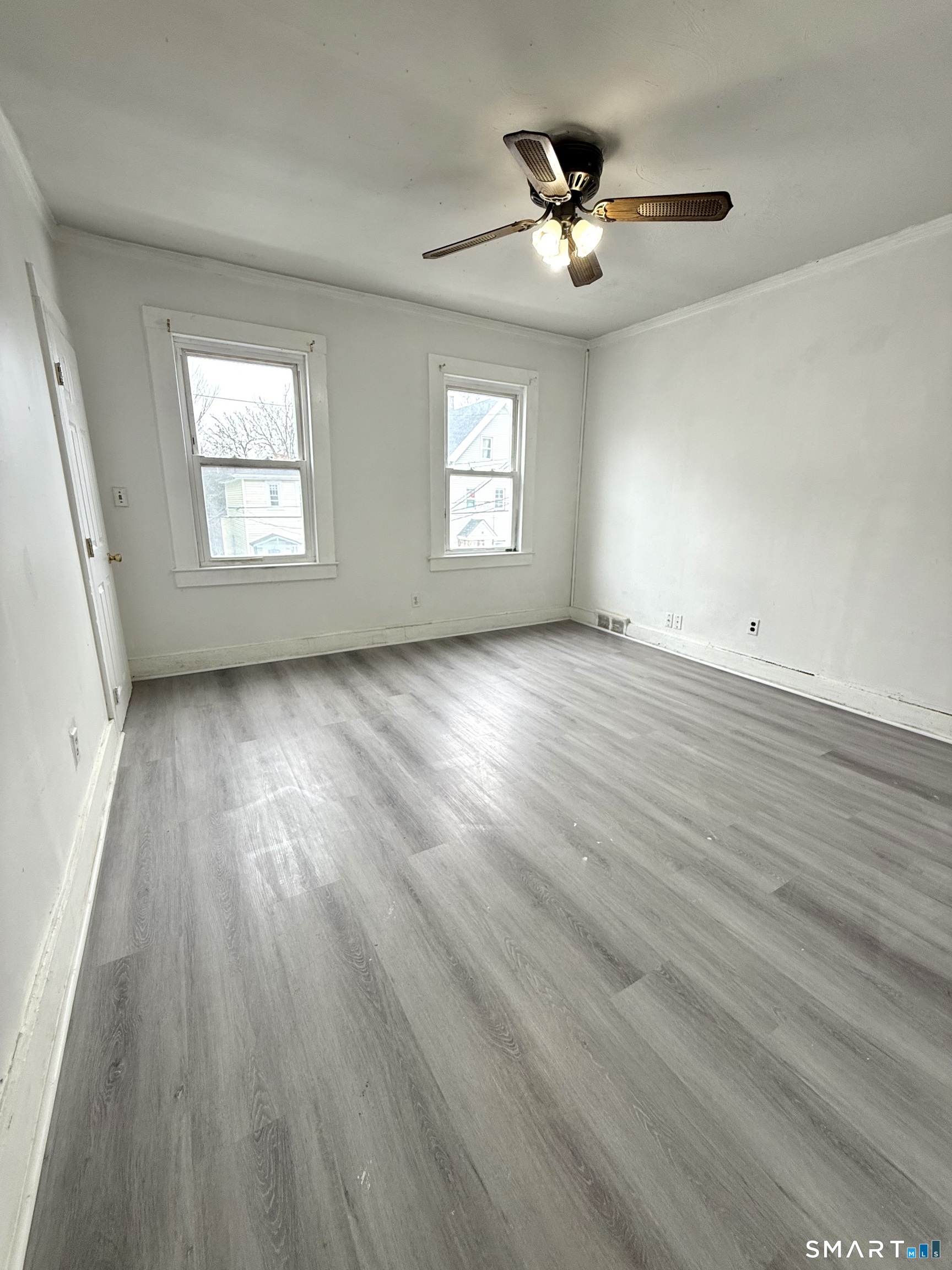 21 Edgar Street, Unit 2 New Haven, CT 06519 - Photo 10 of 20 an empty room with wooden floor and windows