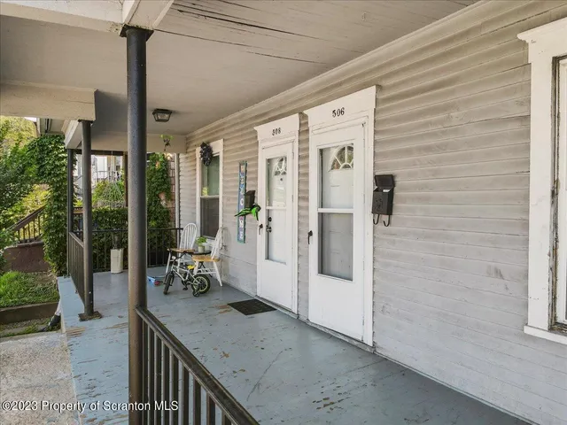 aerial view of a house with a yard and furniture