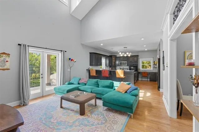 a kitchen with granite countertop stove sink and cabinets