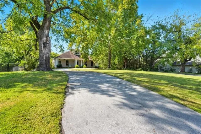 a view of a house with a big yard