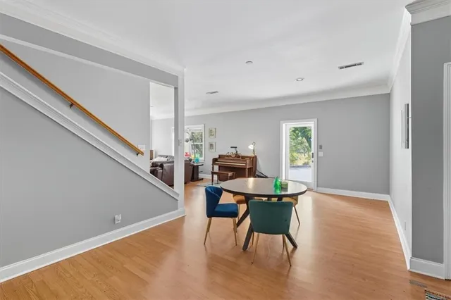 a kitchen with a sink cabinets and wooden floor