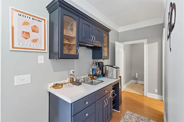 a bathroom with a sink a toilet and a shower