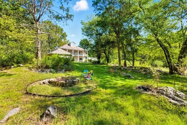 a view of a house with a tree