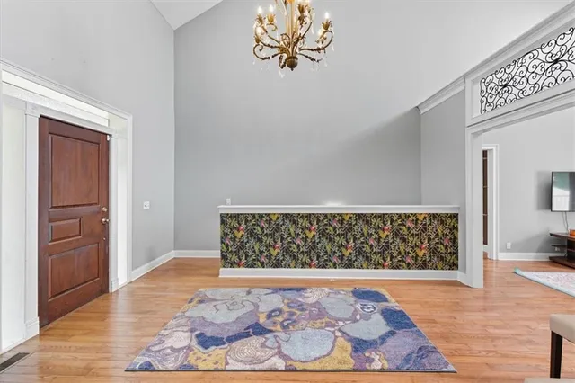a view of a hallway view with wooden floor and staircase