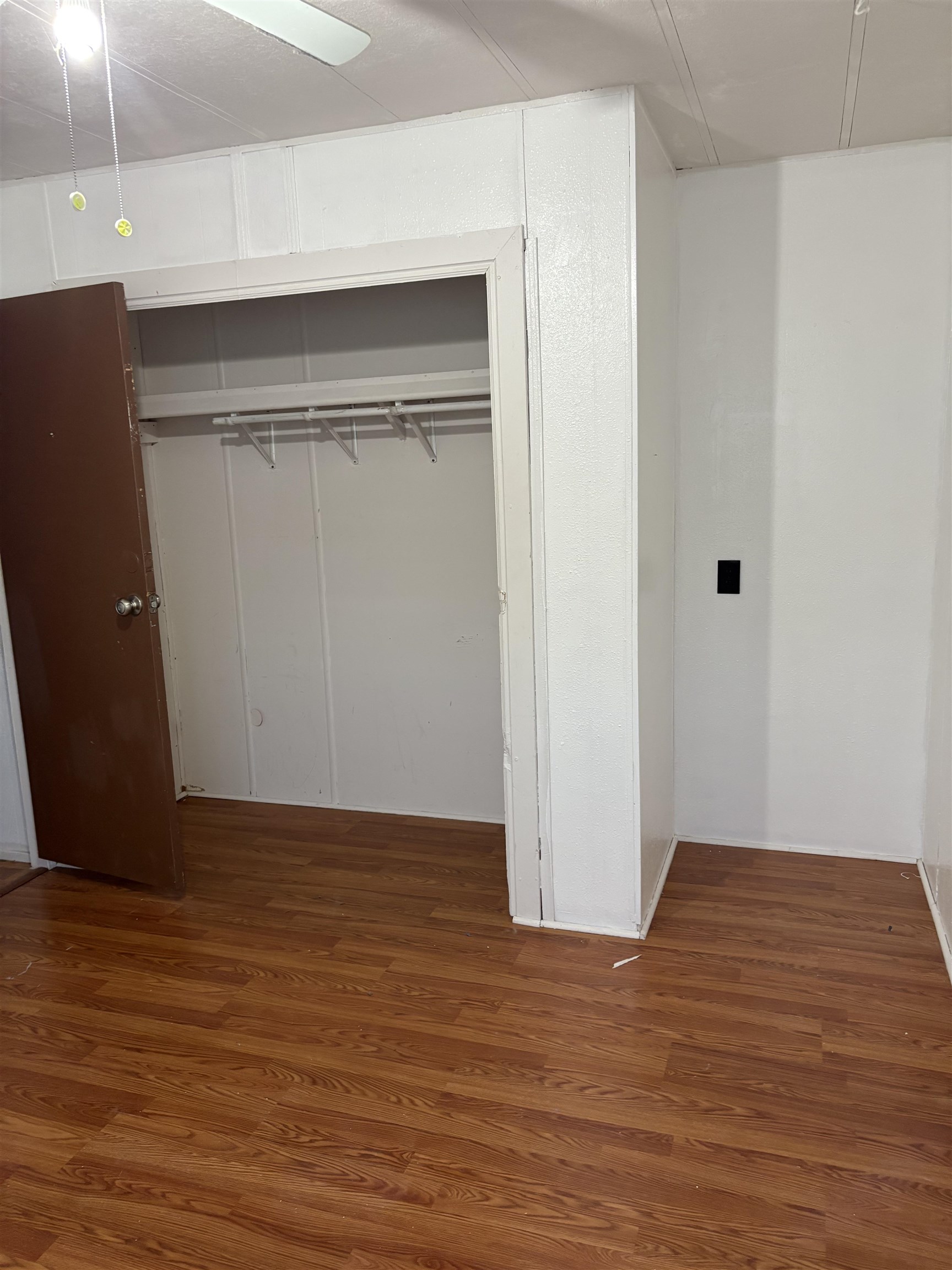 532 Centennial Road Grand Junction, CO 81504 - Photo 16 of 18 a view of an empty room with wooden floor and a window