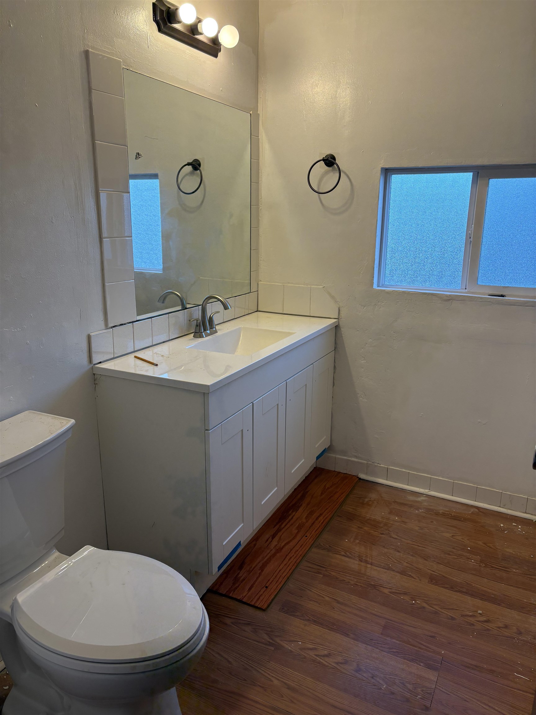 532 Centennial Road Grand Junction, CO 81504 - Photo 6 of 18 a bathroom with a toilet a sink and mirror