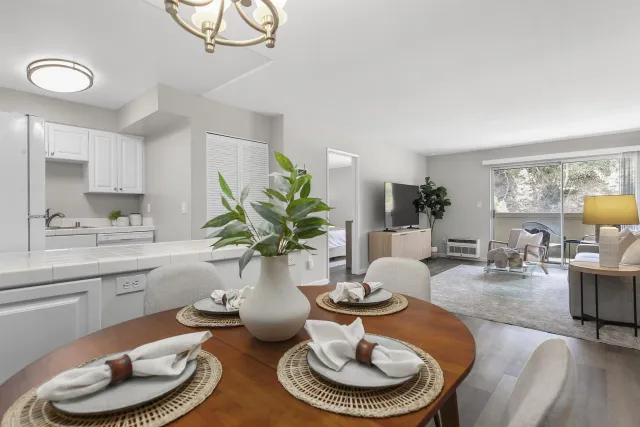 a kitchen with a table and chairs