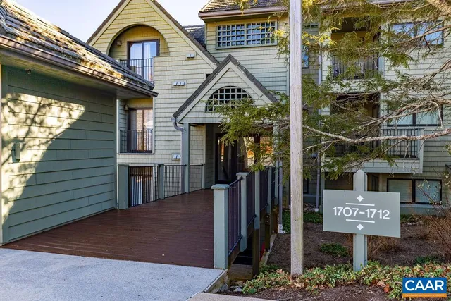 a bedroom with furniture and a book shelf
