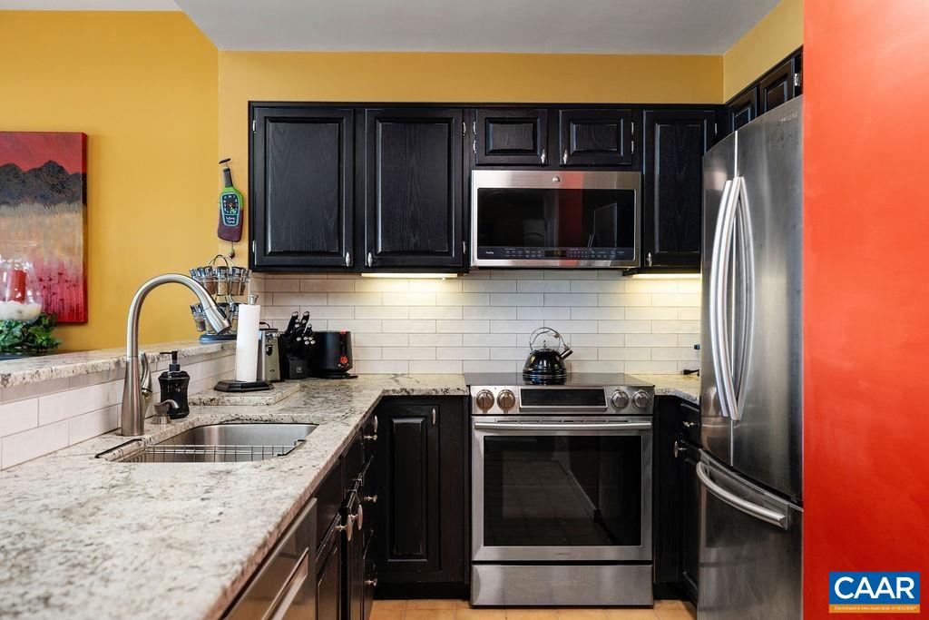 1707 High Ridge Wintergreen, VA 22967 - Photo 12 of 27 a kitchen with granite countertop a sink and steel appliances