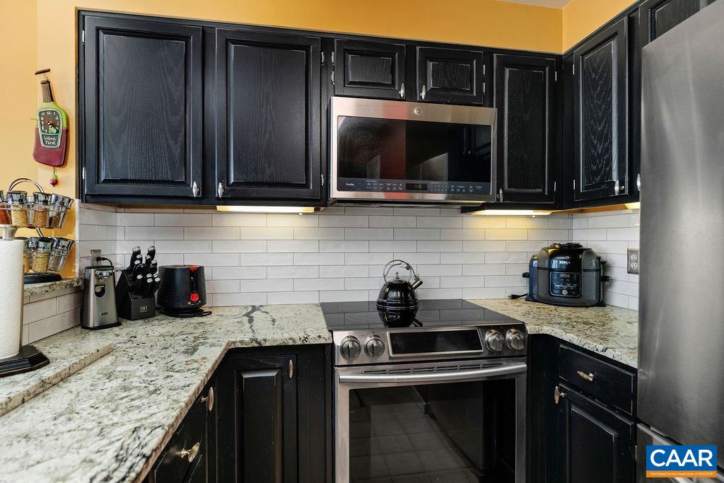 1707 High Ridge Wintergreen, VA 22967 - Photo 13 of 27 a kitchen with a sink a stove and cabinets