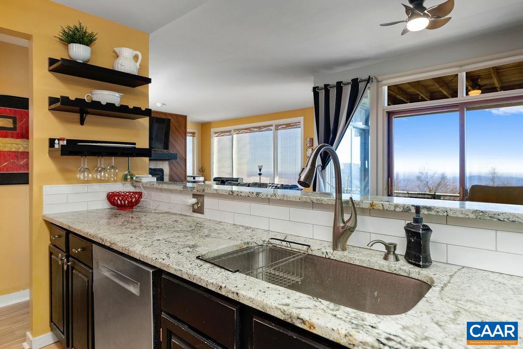 1707 High Ridge Wintergreen, VA 22967 - Photo 14 of 27 a kitchen with a sink and a wooden floor