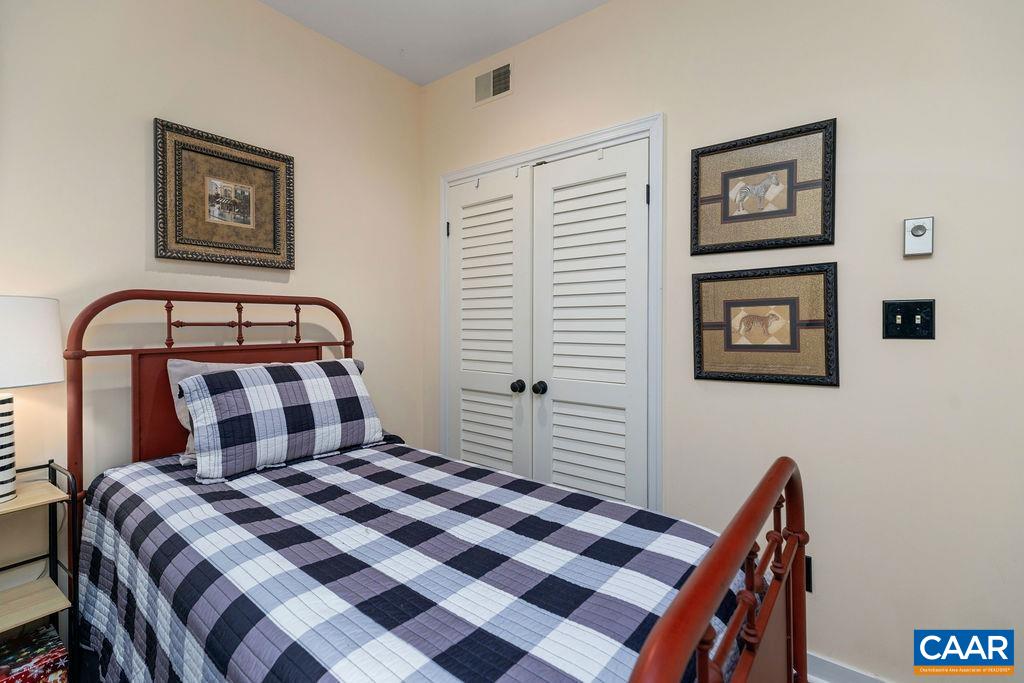 1707 High Ridge Wintergreen, VA 22967 - Photo 16 of 27 a bedroom with a bed and a dresser