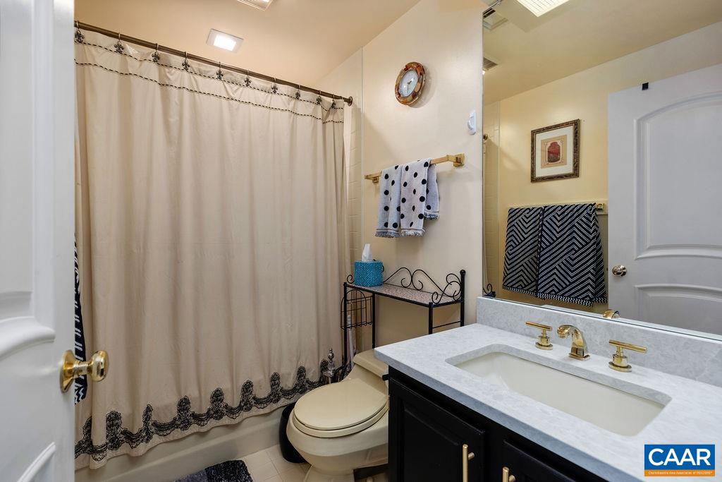 1707 High Ridge Wintergreen, VA 22967 - Photo 17 of 27 a bathroom with a granite countertop sink toilet and a mirror